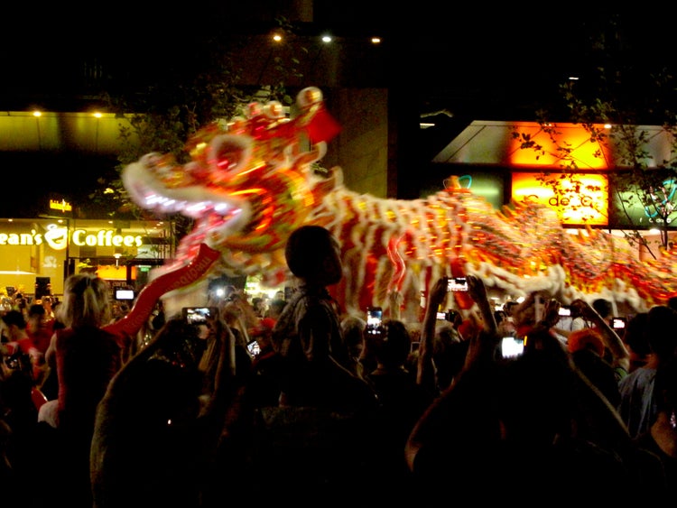 Carousel parading with people mobile phones