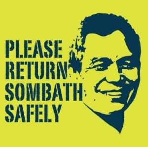 A yellow background with a blue image of the face of Sombath Somphone and the words 'please return Sombath safely'.