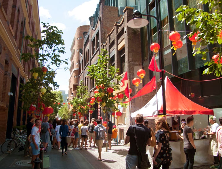 Red lanterns and people walking around