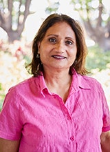 Image of Cheryl D'Cruz wearing an embellished black and white top