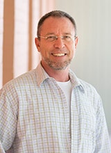 Terry Fairclough with trees in the background.