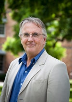 Professor Tim Rowse with trees and the Female Orphan School in the background.