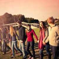 A group of young people walking together.