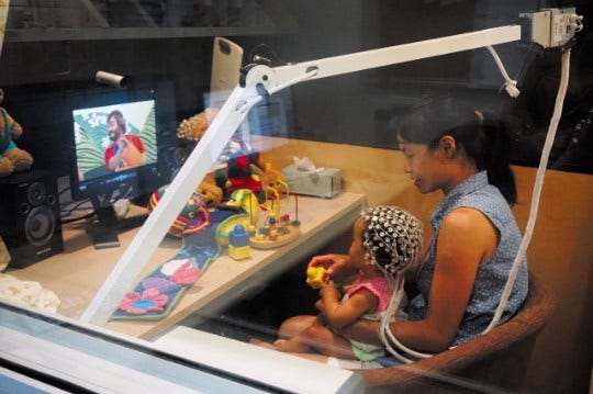 Mother and baby participating in research project