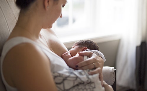 Woman breastfeeding her baby