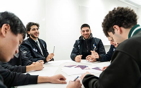 Students working in group activities as part of the conference.