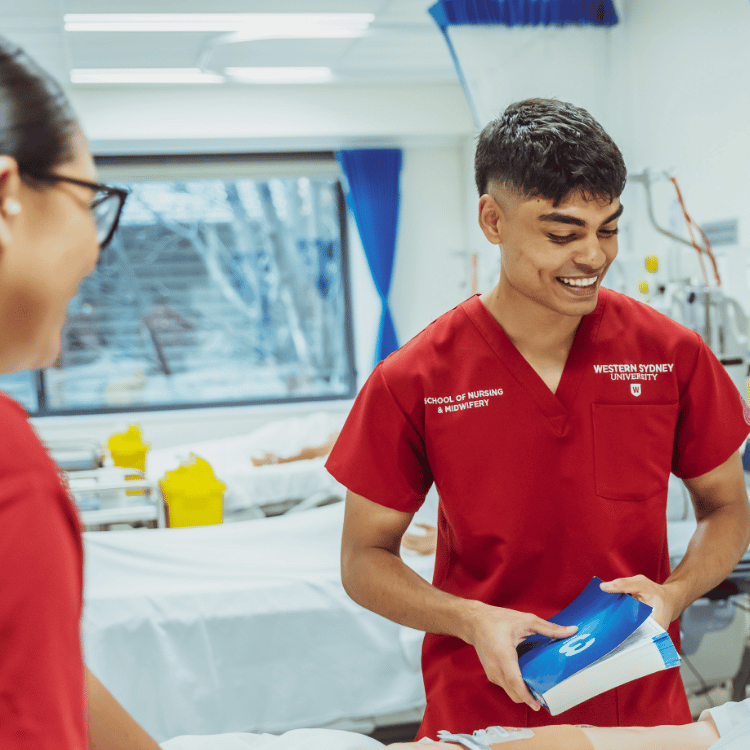 Students for the School of Nursing and Midwifery attending pretend patient.