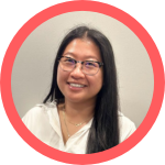 photo of smiling person with long dark straight hair, smiling at the camera