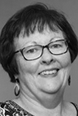 Headshot of Angela Dew.