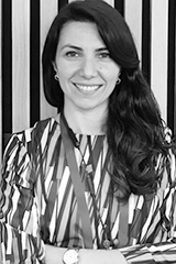 Headshot of Oya Gumuskaya.