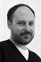 Headshot of Garth Lean.