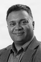 Headshot of Navin Naidoo.