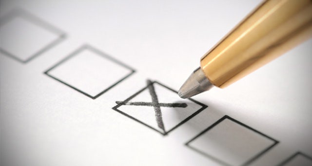 Pencil and check boxes on a paper form