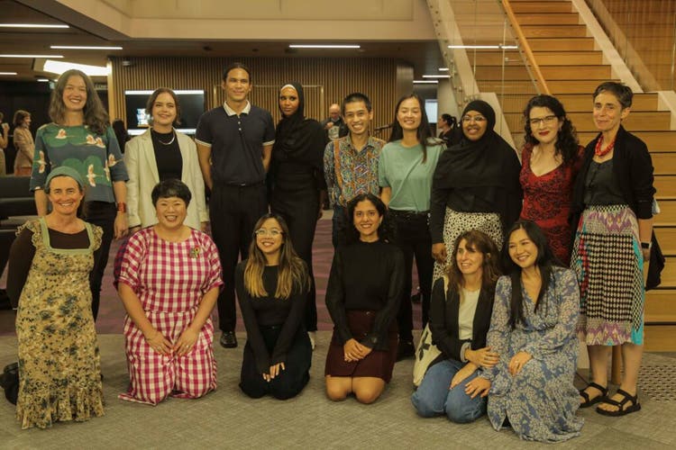 Writing Zone cohort. A group of writers smile at the camera.