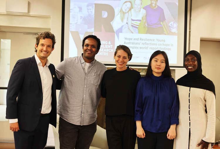 A group of people standing together AI-generated content may be incorrect.