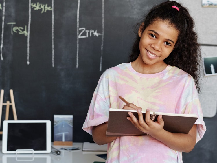 Girl using notebook and tablet